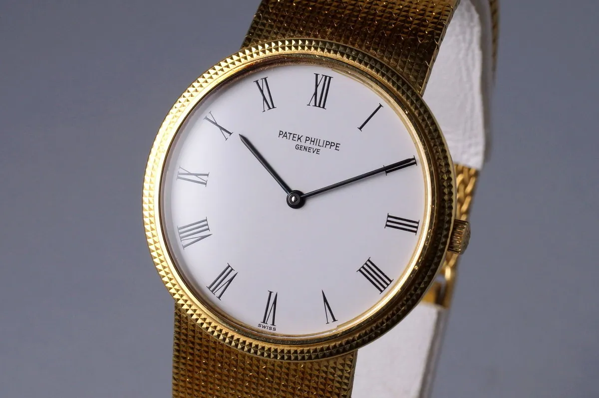 Vintage YG Patek Philippe Quartz 3954 with Box and Papers